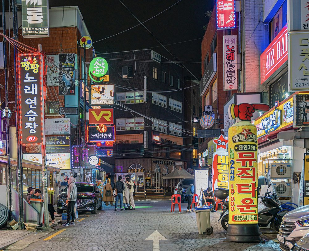 Neon-lit nightlife street in Gangnam Seoul with vibrant bars and city lights | Photo from Ethan Brooke on Pexels