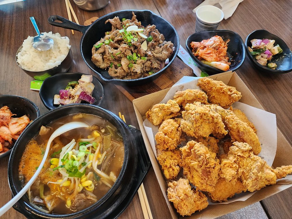 Crispy Korean fried chicken with classic side dishes