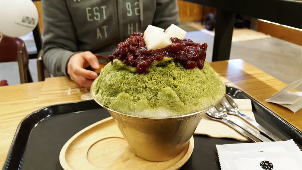 Green tea bingsoo shaved ice dessert with red bean