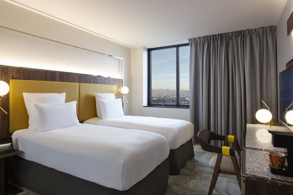 Modern guest room at Pullman Paris Montparnasse, one of the best family hotels in Paris, France