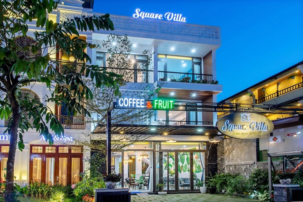 Bright and modern exterior of Square Villa Hoi An at night