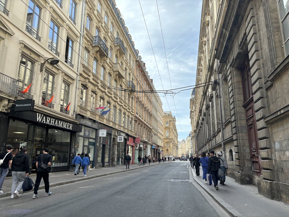 Lyon city street with historic buildings and local shops in France