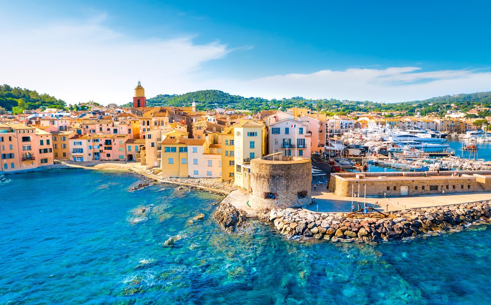 Saint-Tropez harbor with pastel buildings and turquoise Mediterranean waters