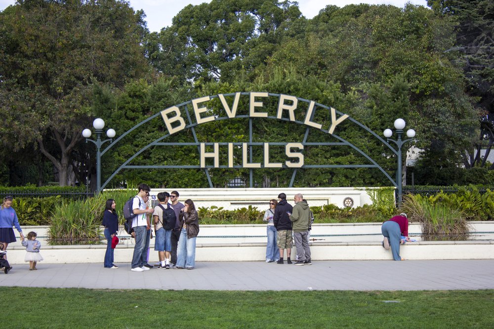 Beverly Hills sign landmark with visitors in Los Angeles park