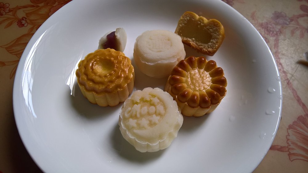 Traditional Vietnamese mooncakes Banh Deo and Banh Nuong on a plate