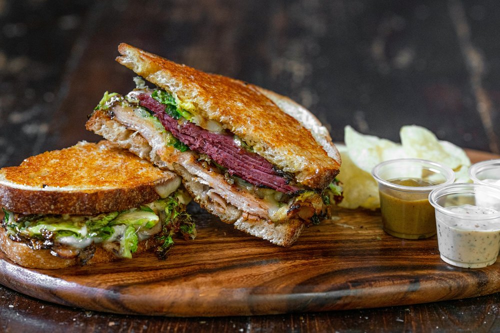 A hearty roast beef sandwich served with tasty sides | Photo Credit: Daniel Torobekov on Pexels