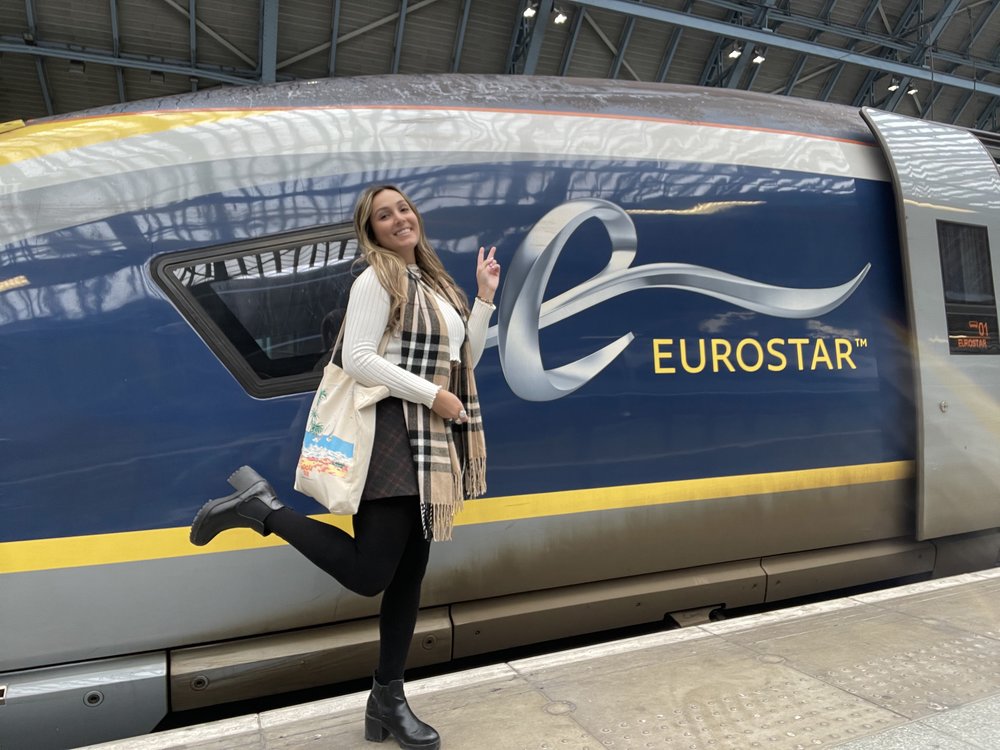 Eurostar train at the station with a traveler posing