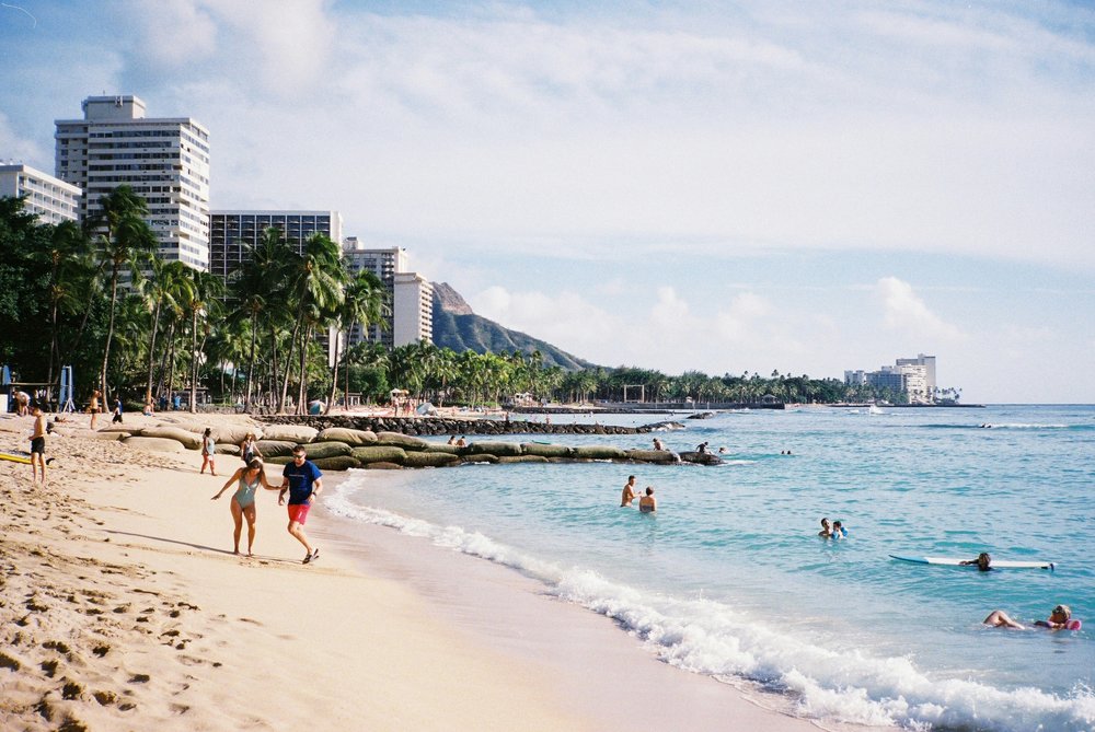 Waikiki Beach with ocean views and city skyline in Honolulu | Photo Credit: Alexandra Nelson on Unsplash