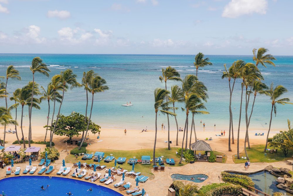 Kahala Beach with palm trees and calm ocean views