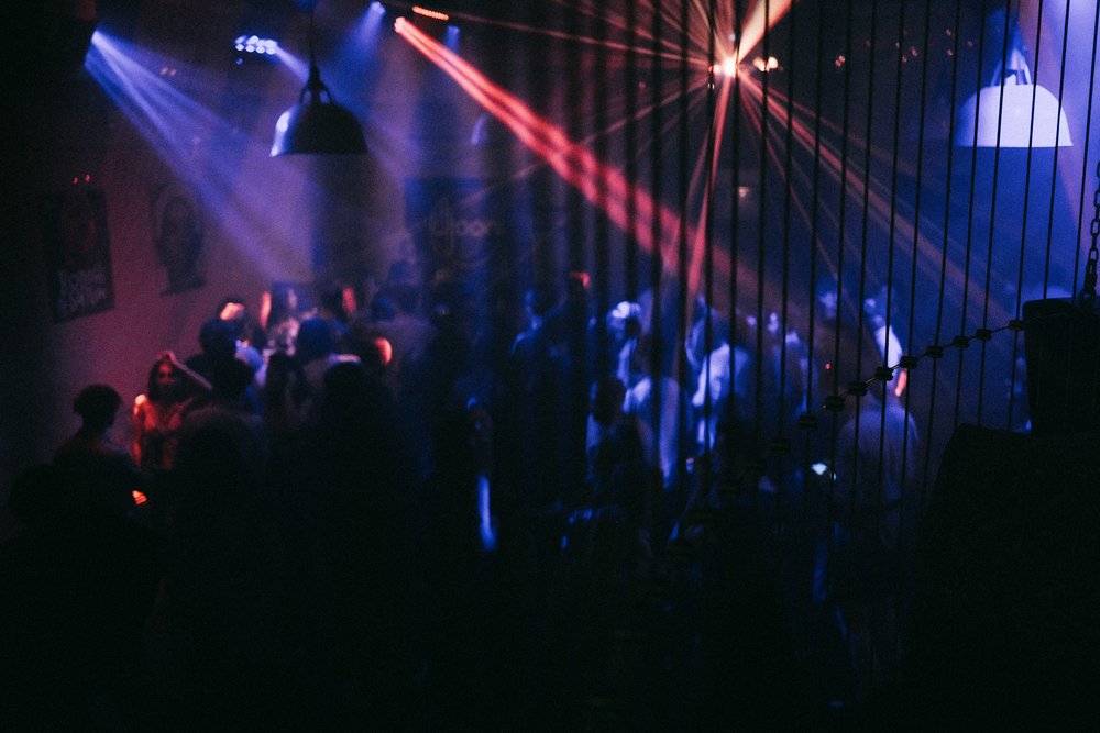 People socializing at a dance club