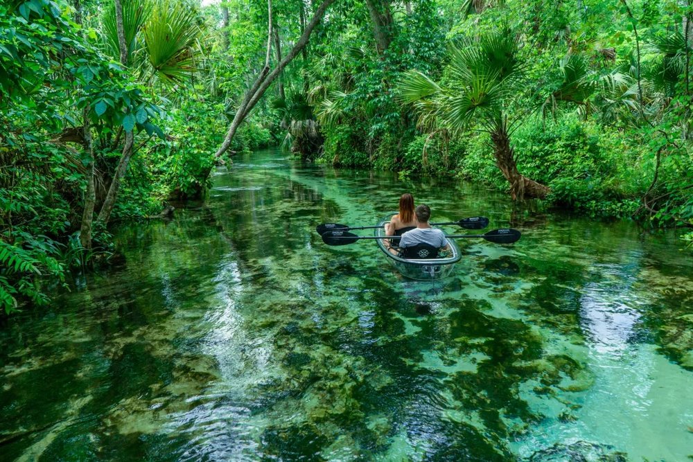 Couple kayaking through clear waters at Rock Springs in Orlando