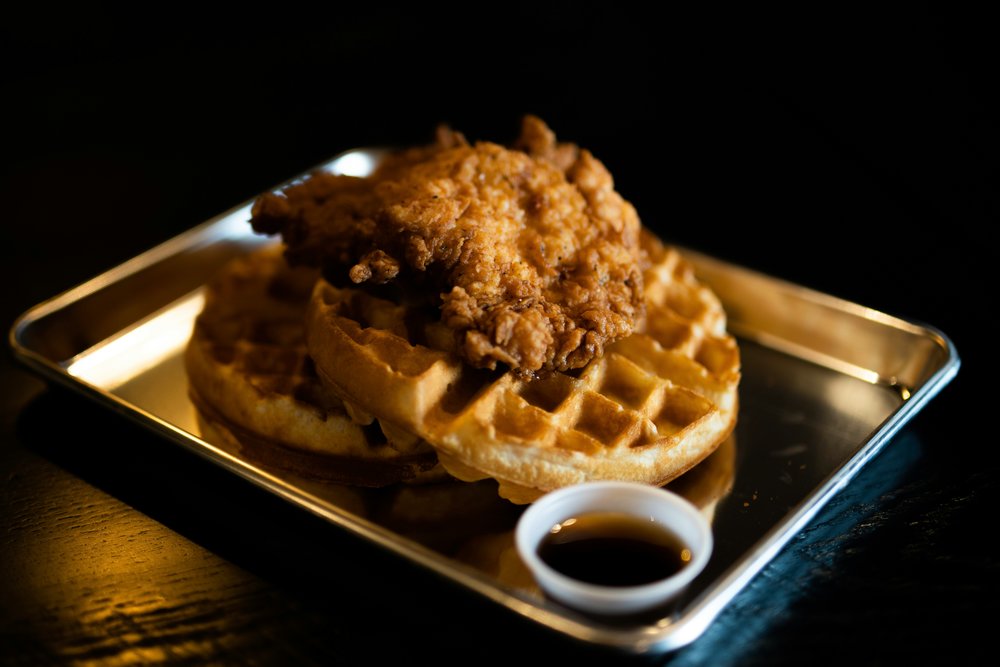 Crispy fried buttermilk chicken and waffles | Photo Credit: Miguel Dominguez on Unsplash
