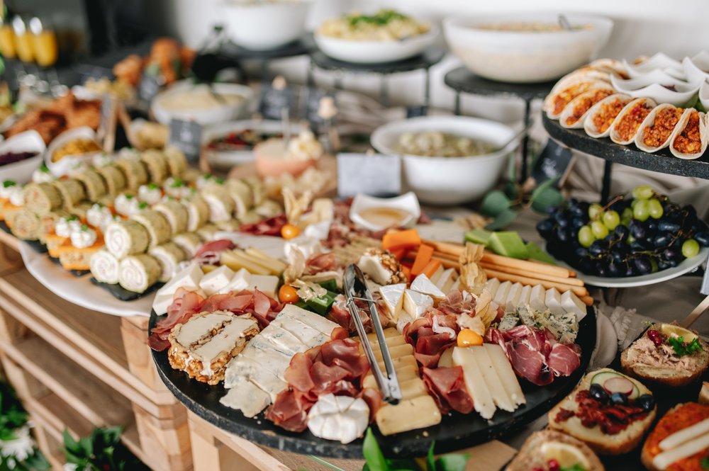 Colorful brunch spread with cheese, fruits, and fresh bites | Photo Credit: Wikimedia Commons
