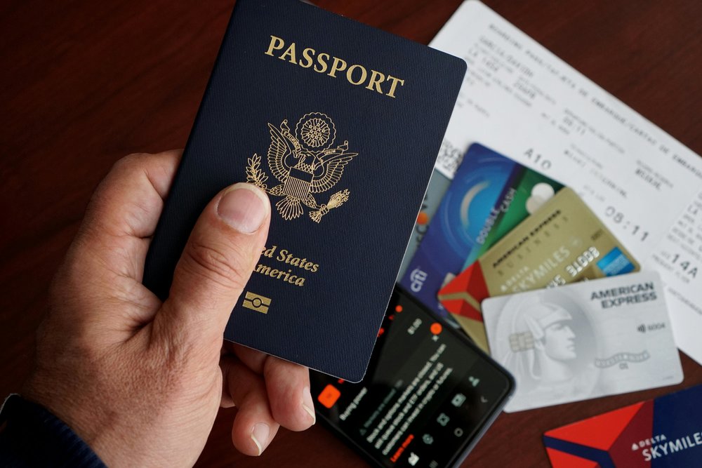 US passport with travel essentials | Photo Credits: Dave Garcia on Pexels