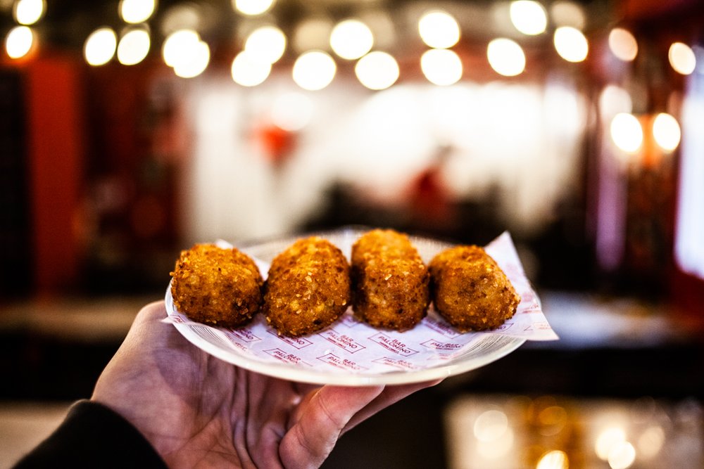 Crispy croquetas like a bomba de la Barceloneta in Barcelona tapas bar, golden bite-sized Spanish favorite