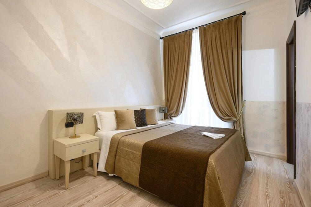 Minimalist bedroom at Cola di Rienzo Suite Rome