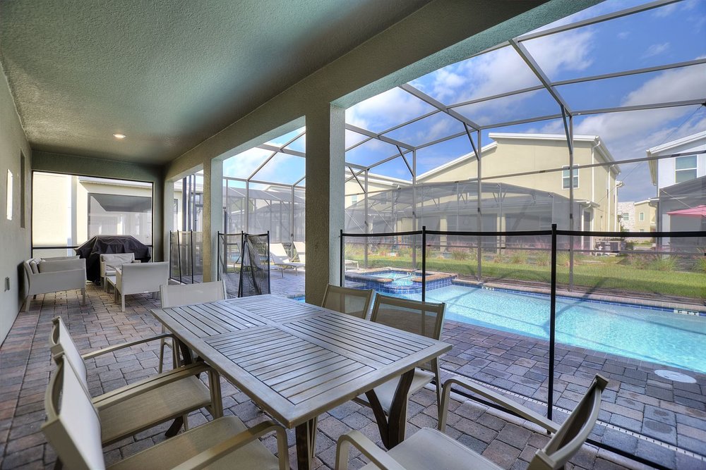 Private screened pool and patio in a Treat Retreat at Storey Lake