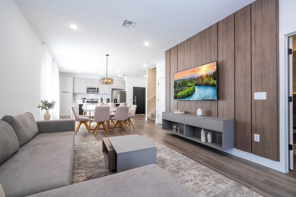 Modern living and dining space in Doppio Westside Villas