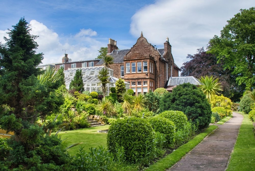 Scenic gardens and historic buildings at Auchrannie Resort on the Isle of Arran