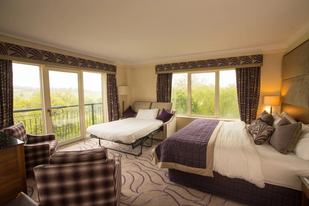 Spacious family room with large windows at Celtic Manor Resort Wales