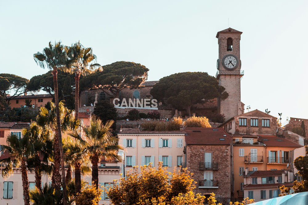 Clock tower with Cannes sign