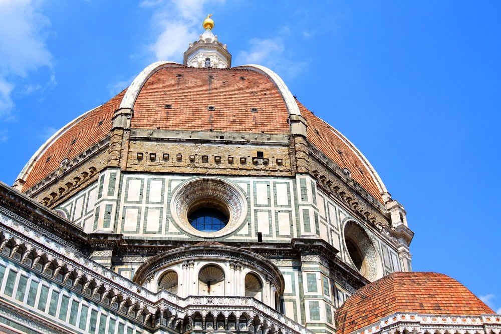 Detailed view of Florence Duomo dome with marble facade and terracotta roof