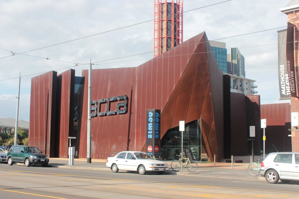 ACCA’s iconic rust-red steel building / Photo credit: Robi882002 on Wikimedia Commons