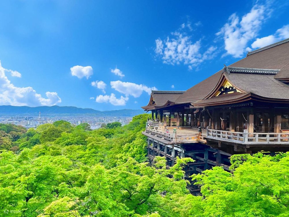 he Kiyomizu-dera wooden stage surrounded by lush trees