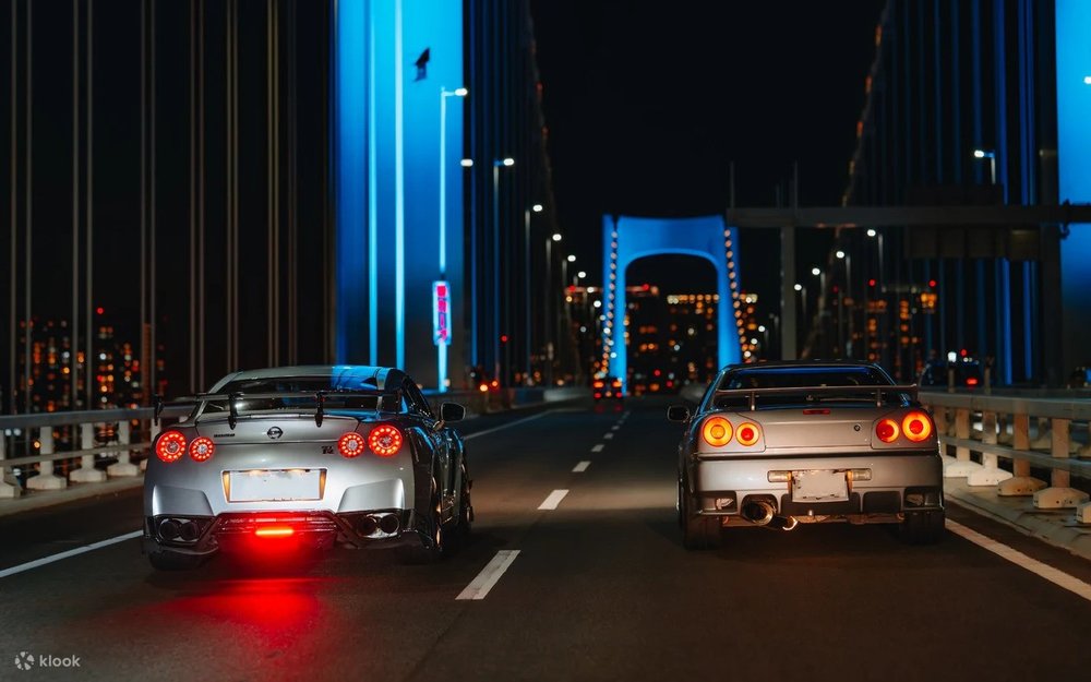 Night riders passing through the illuminated Odaiba Rainbow Bridge!