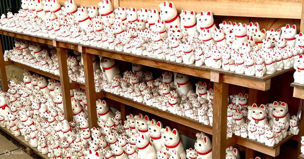 Rows and rows of maneki-neko, the lucky cat!