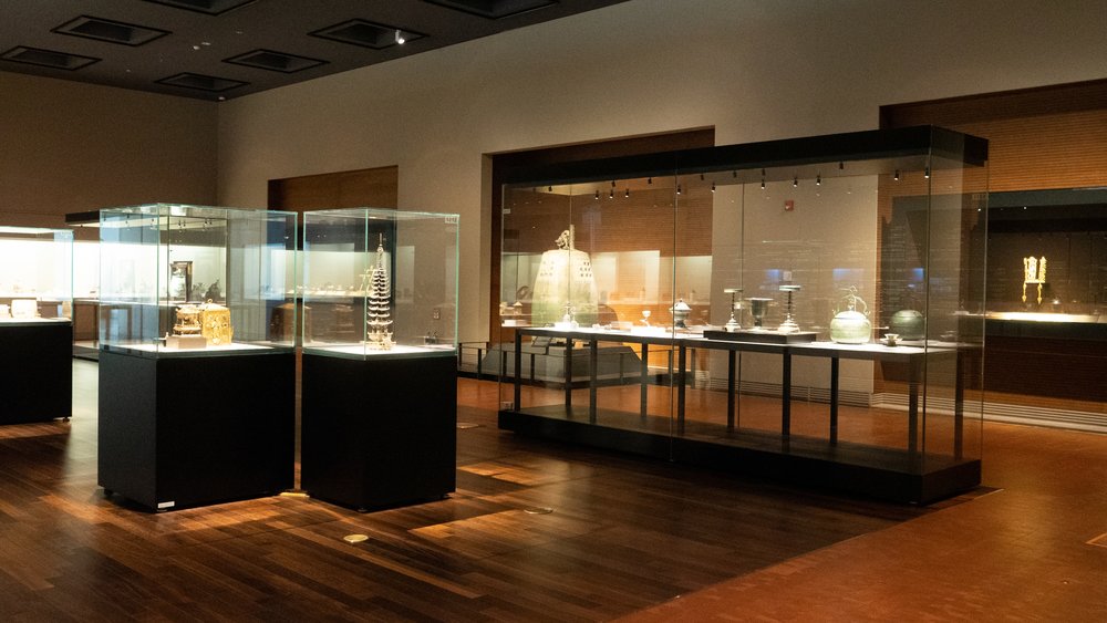 Interior of National Museum of Korea showing artifacts displayed in glass cases