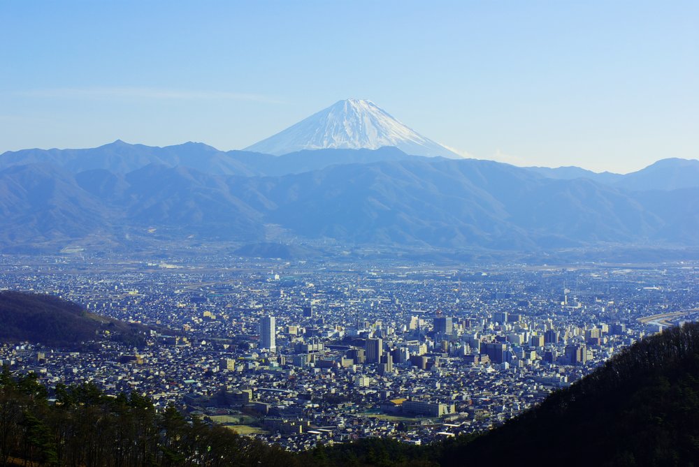 Scenic Kofu cityscape with Mount Fuji in the background