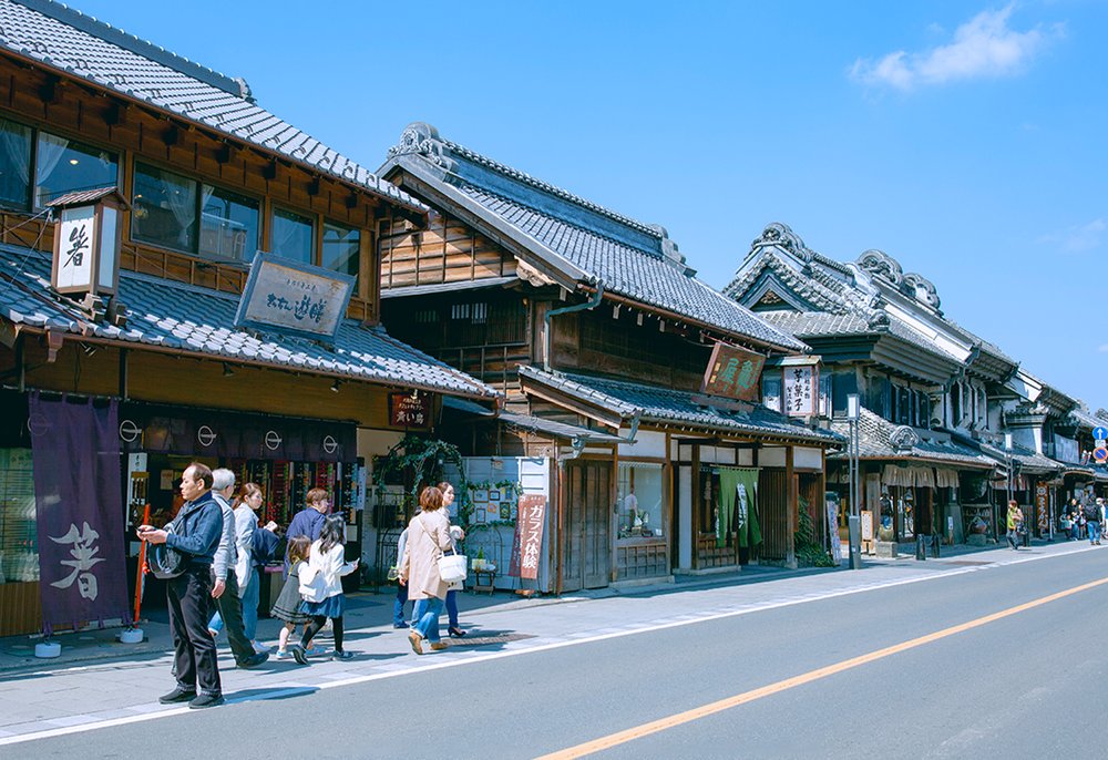 Traditional Kawagoe street with wooden shops and visitors