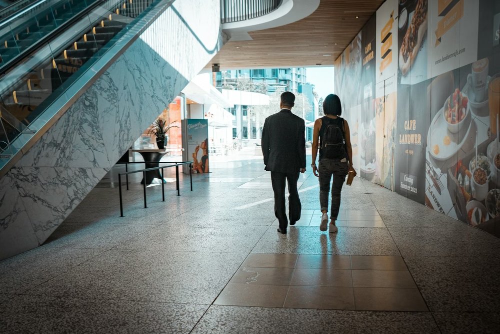 A couple walking inside the mall