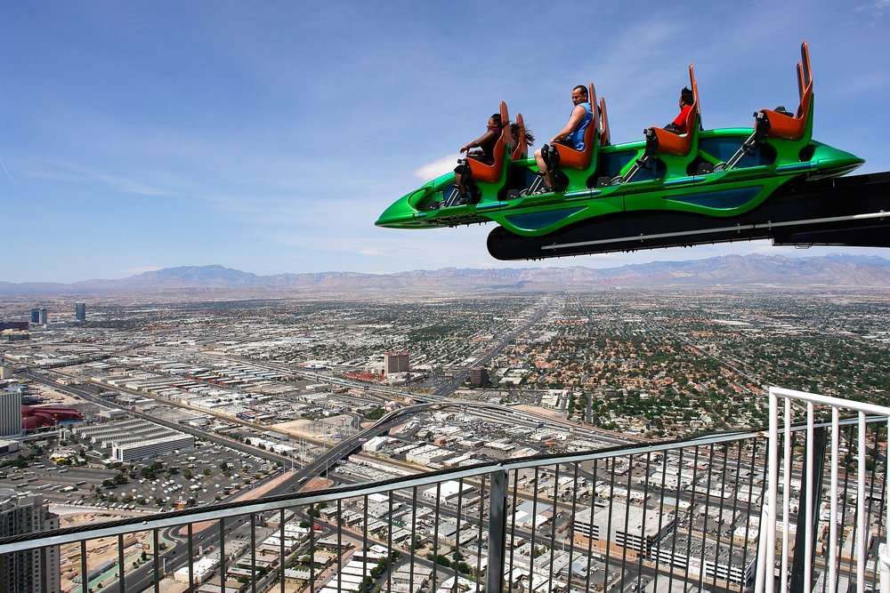 People on a rollercoaster in the sky