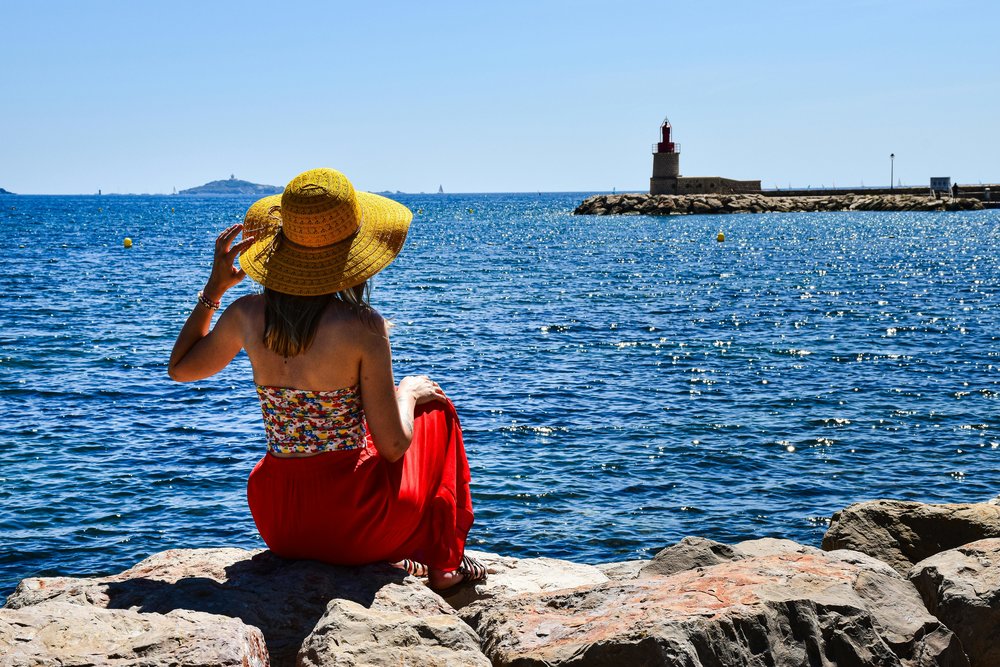 Tourist admires the sea view at Provence-Alpes-Côte d'Azur, France | Photo Credit: AXP Photography on Pexels