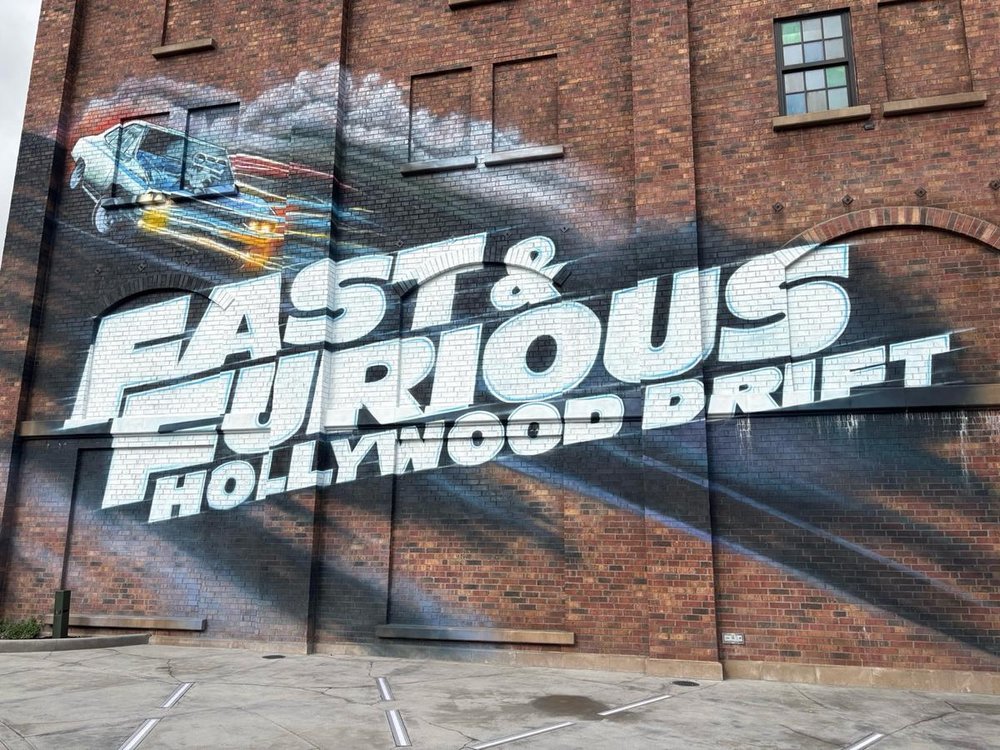 Fast & Furious: Hollywood Drift graffiti promo on wall