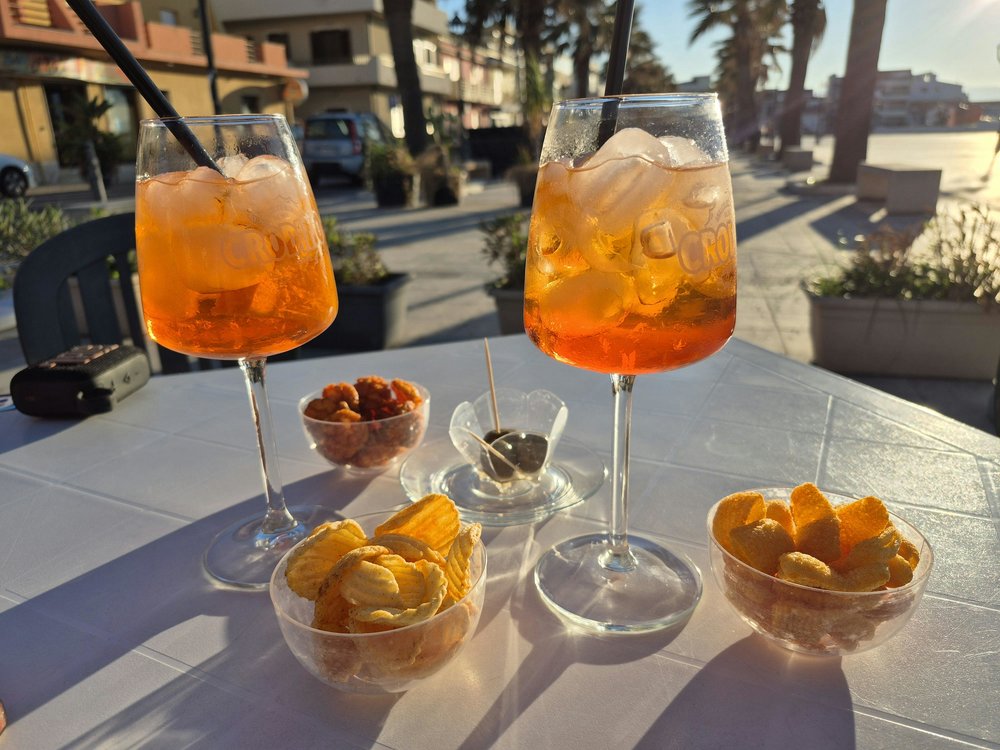 Refreshing Aperol Spritz and snacks | Photo Credit: Ilma Elsberga on Pexels