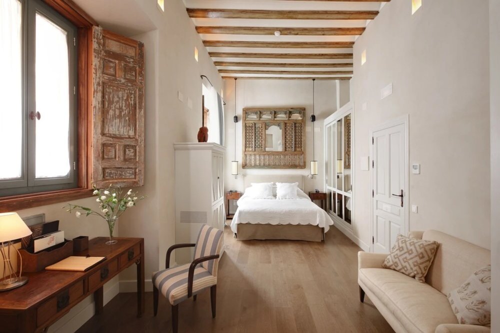 Bright suite with wooden beams at Hotel Boutique Corral del Rey Seville