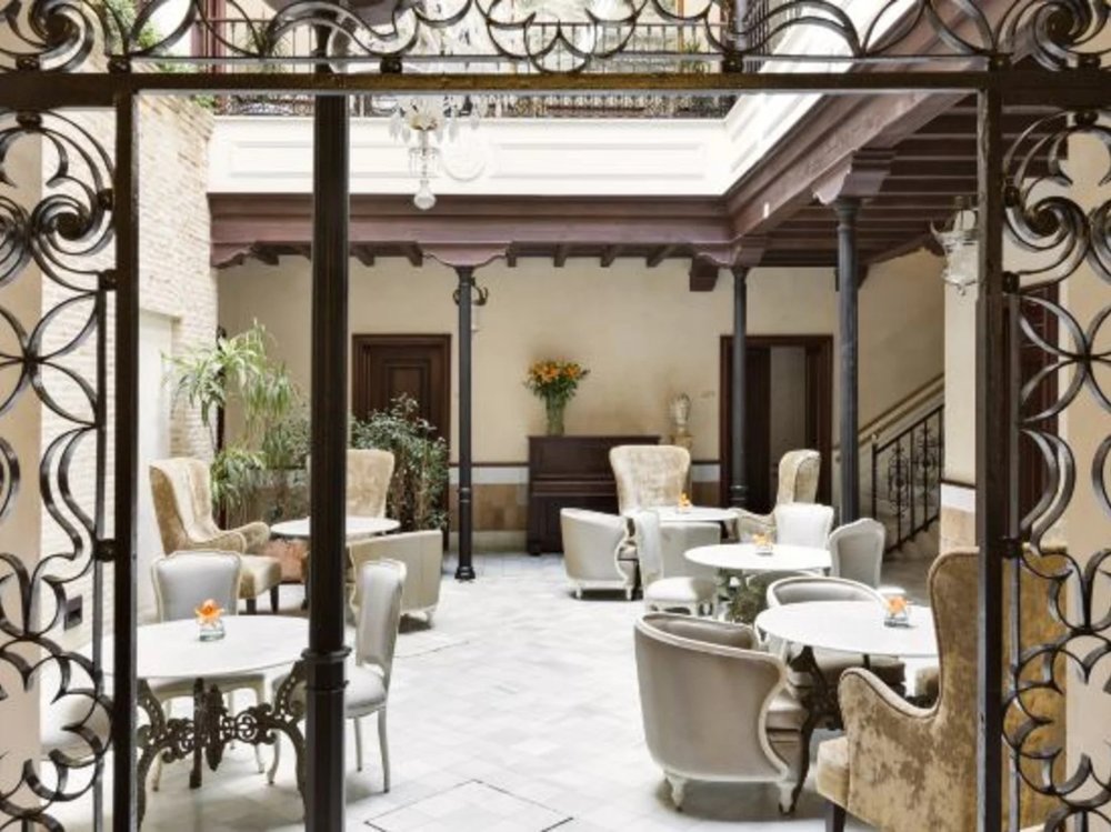 Elegant courtyard lounge at Hotel Casa 1800 Seville