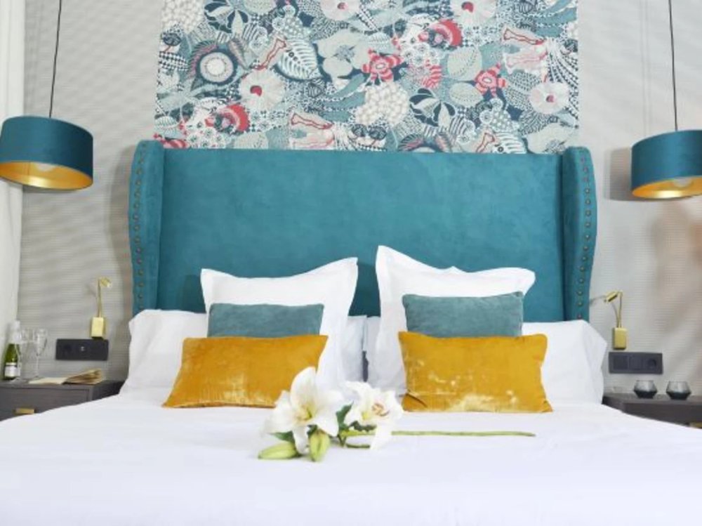 Colorful bedroom with bold decor at Soho Boutique Hotel Seville