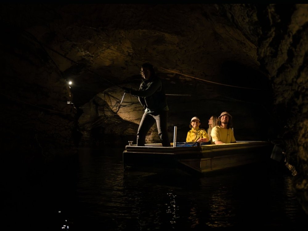 Cruising along the underground Te Anau Glowworm Cave.