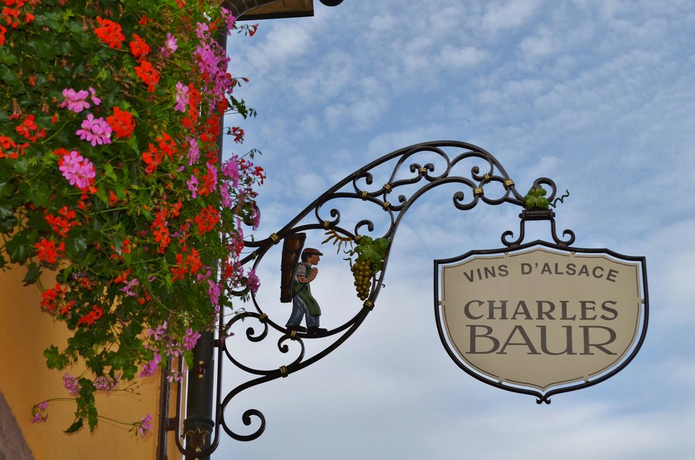 Local wine shop sign in Alsace, France