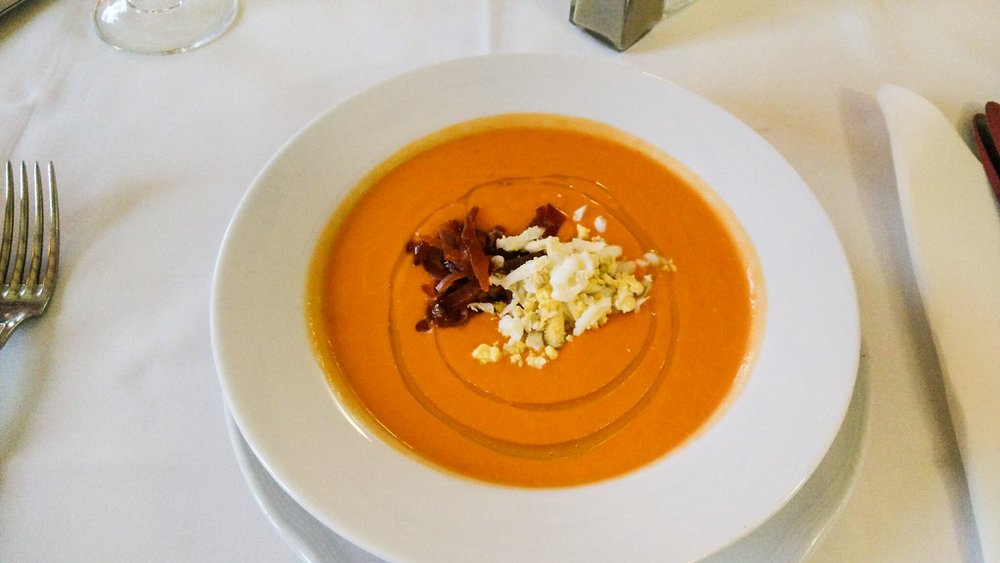 Creamy salmorejo topped off with crumbled hard-boiled egg and jamon | Photo Credit: Flickr
