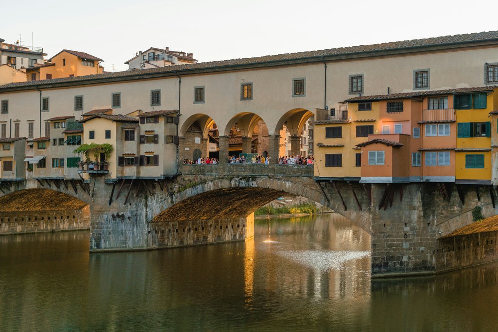  Tourists relaxing in bridge of Ponte Vecchio | Photo Credit: Matt Hardy on Unsplash