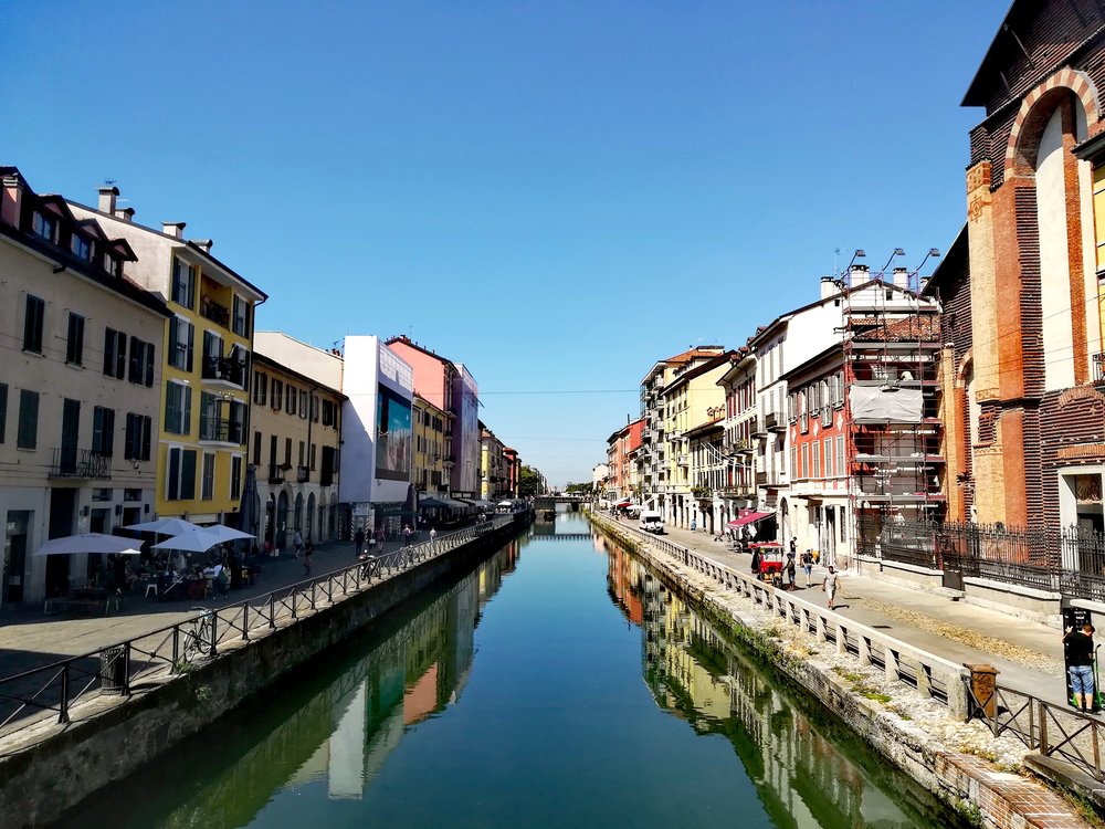 Scenic canal view in Milan’s Navigli district | Photo Credit: Wikimedia Commons