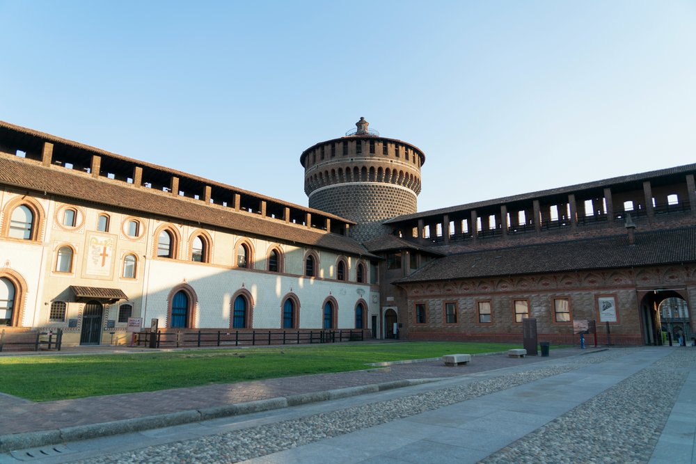 Courtyard and tower inside Castello Sforzesco in Milan | Photo Credit: Marian Florinel Condruz on Unsplash