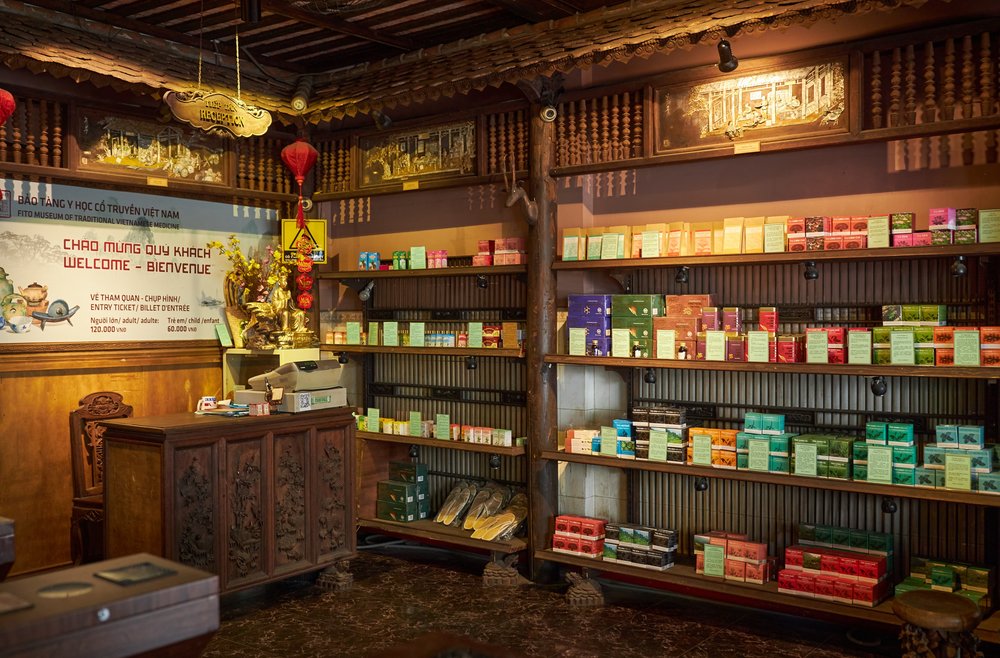 Wooden interior of FITO Museum with shelves of traditional Vietnamese medicine products