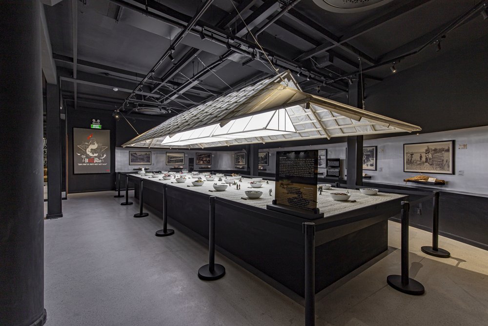 Indoor Pho Museum exhibit with bowls, displays, and a roof-style installation in Ho Chi Minh City