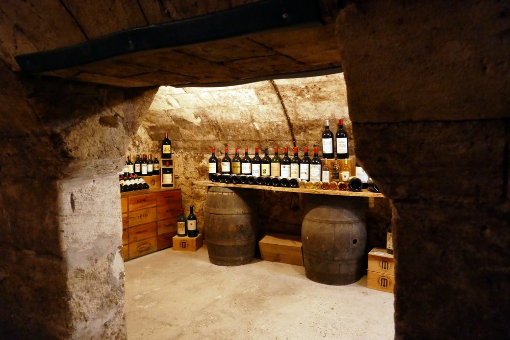 Bordeaux wine cellar filled with vintage bottles in Musée du Vin et du Négoce de Bordeaux | Photo Credit: Wikimedia Commons